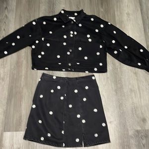 Two piece button up jean jacket with daisies on top and on the skirt